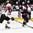 GRAND FORKS, NORTH DAKOTA - APRIL 17: USA's Clayton Keller #19 skates with the puck while Latvia's Roberts Kalkis #27 chases him down during preliminary round action at the 2016 IIHF Ice Hockey U18 World Championship. (Photo by Matt Zambonin/HHOF-IIHF Images)

